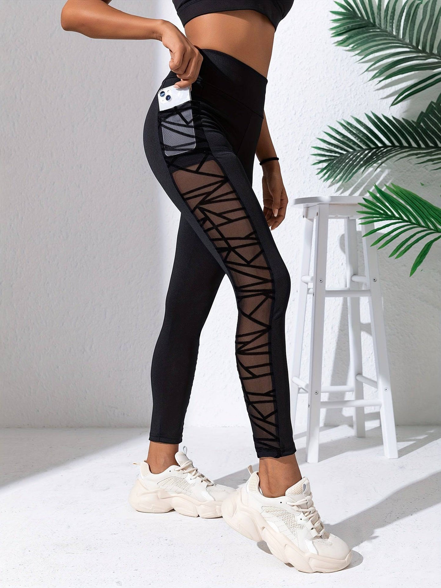Schwarze Netz-Sticktaschen-Sportleggings