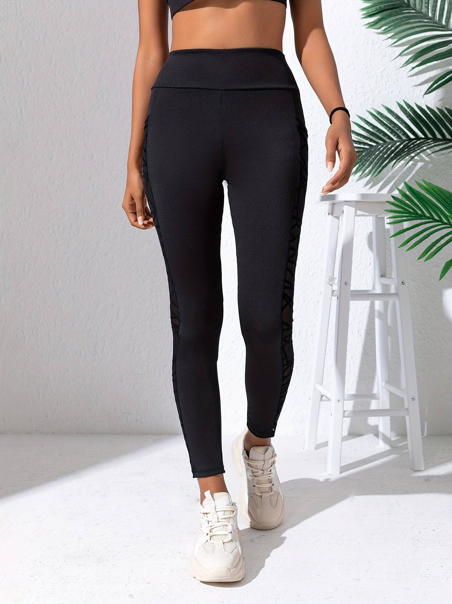 Schwarze Netz-Sticktaschen-Sportleggings