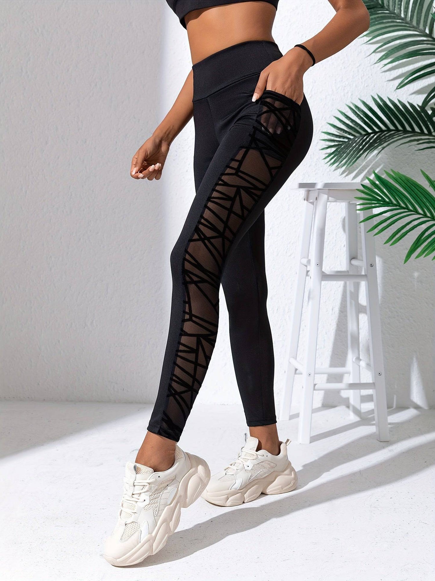 Schwarze Netz-Sticktaschen-Sportleggings