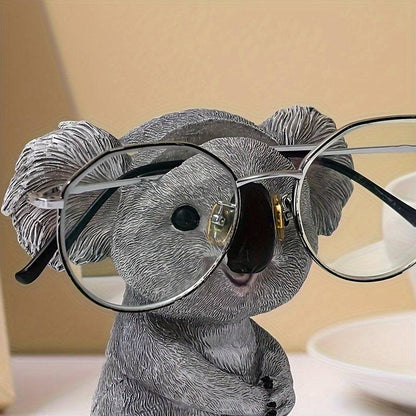 1pc Koala Ornament - Brillenhalter, Harzstatue für Bücherregal Wohnzimmer Büro Cafe Dekor, Winter Weihnachten Neujahr Dekor. 

Neuer Titel: Koala Ornament - Brillenhalter, Harzstatue für vielseitiges Wohnraumdekor.
